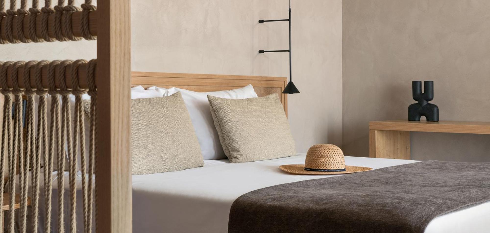 Helea Lifestyle Beach Resort Kallithéa 외부 사진 A bed with a straw hat