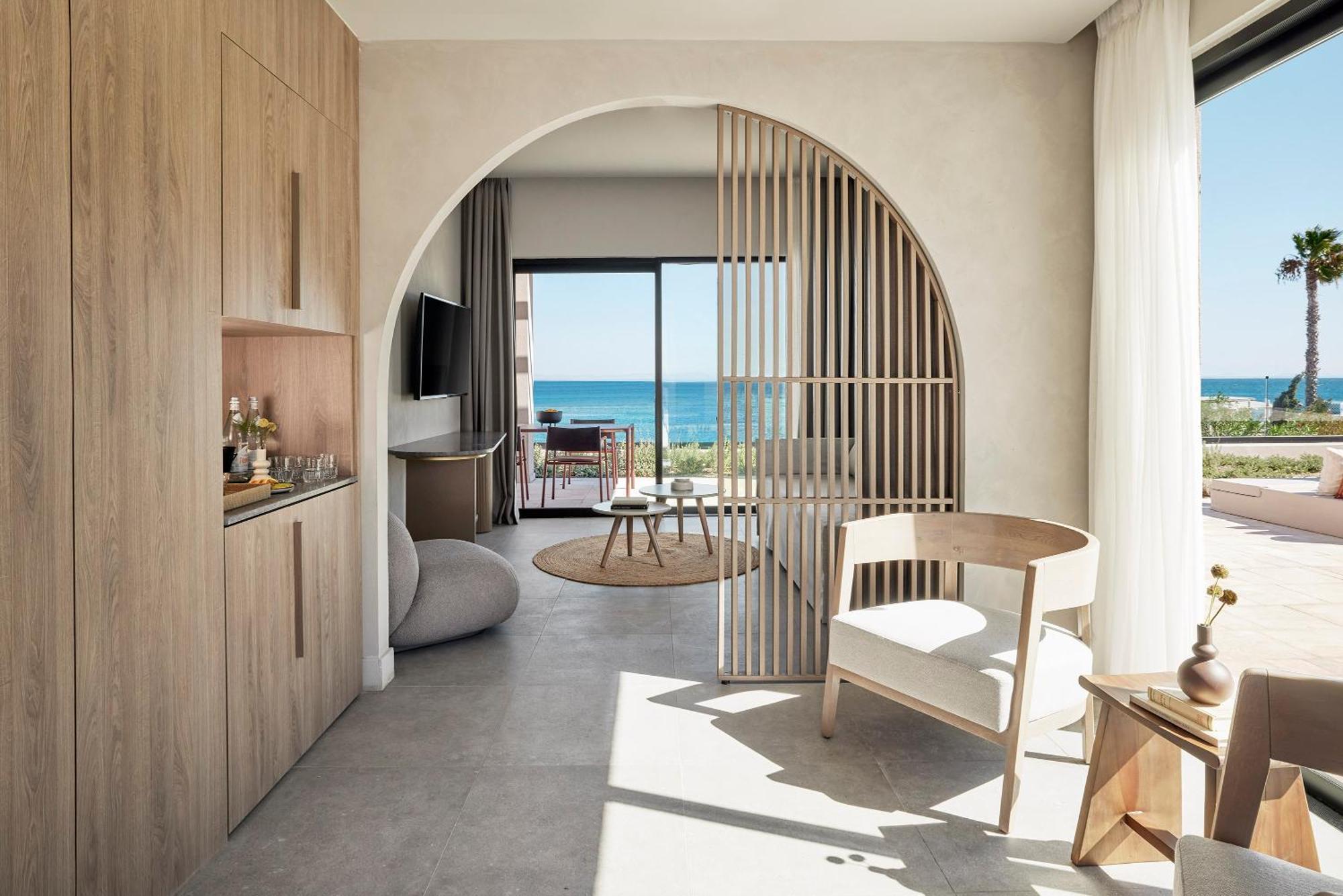 Helea Lifestyle Beach Resort Kallithéa 객실 사진 Interior of a suite at the hotel